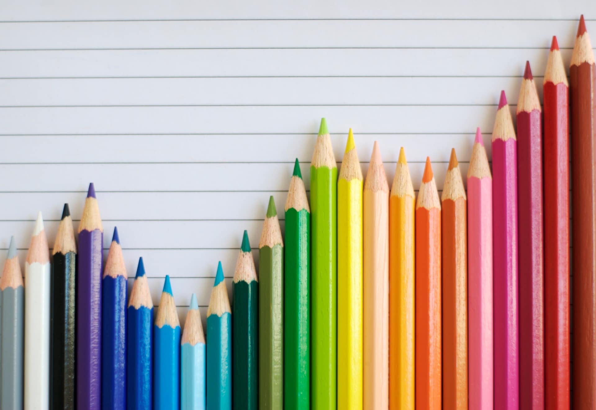 a group of colored pencils arranged in the form of a line graph